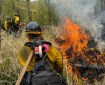 Firefighters with the Gannett Glacier Fire crew conduct a prescribed burn at the Maud Road shooting range in Palmer.