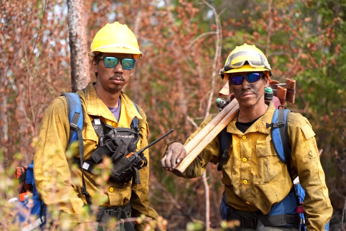 Firefighters assigned to the Oskawalik Fire (#122) continue to mop and patrol the fire take time to pose for the camera.