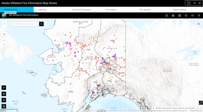 A large map of Alaska with tabs at the top and red dots representing wildfires. Topographic features are shown in gray over a white background.