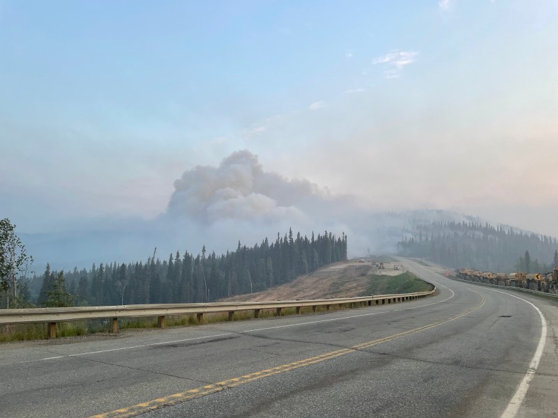 Image of the Parks Highway with smoke billowing over the highway in the distance