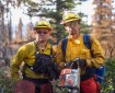 Two sawyers on the Southwest Crew #4 pose for a photo with there chainsaw on the Nelchina Glacier Fire.