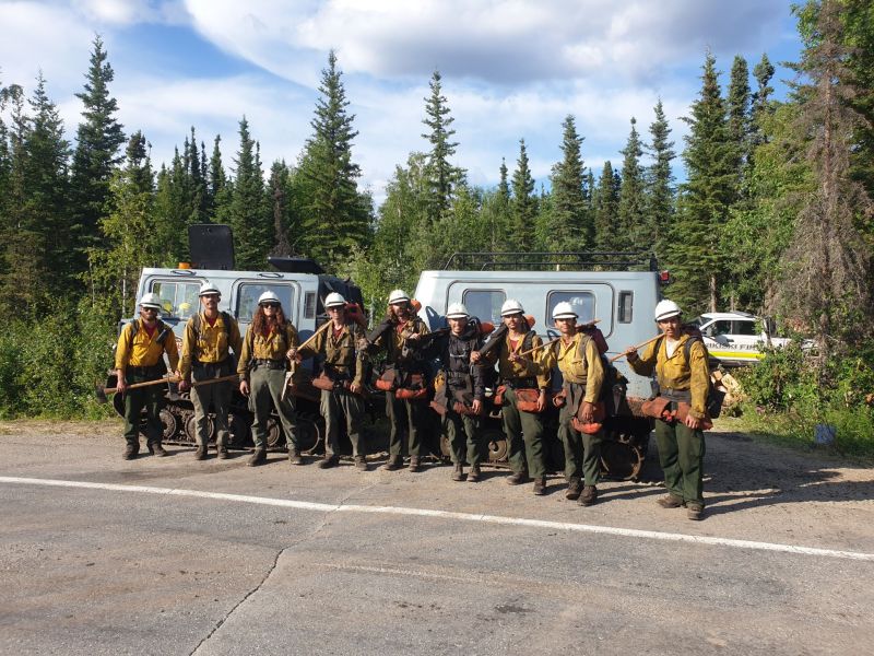 Handline crews pose with snow cats used for transport to the line.