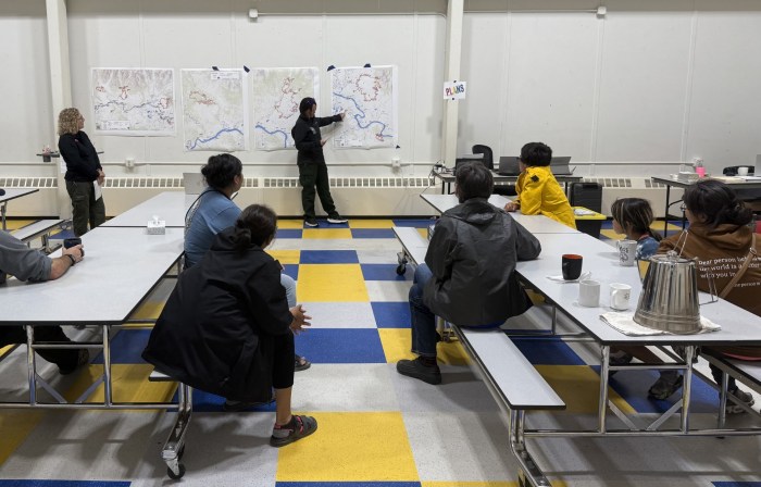 Community members listen to an updated about the Goldrun Complex Fires.