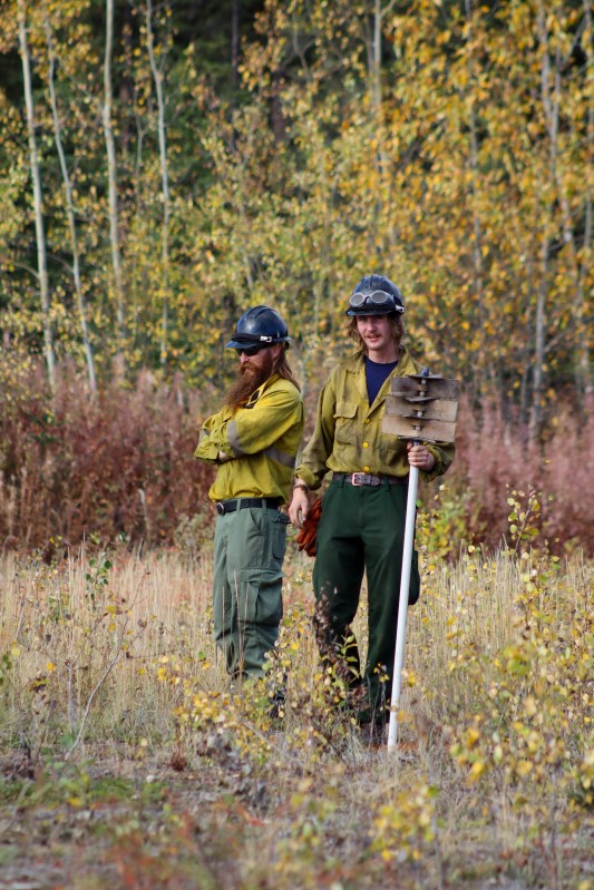 Wildland Fire & Resource Technicians, Colton Neil and Colten Blanchard, monitor the controlled burn.
