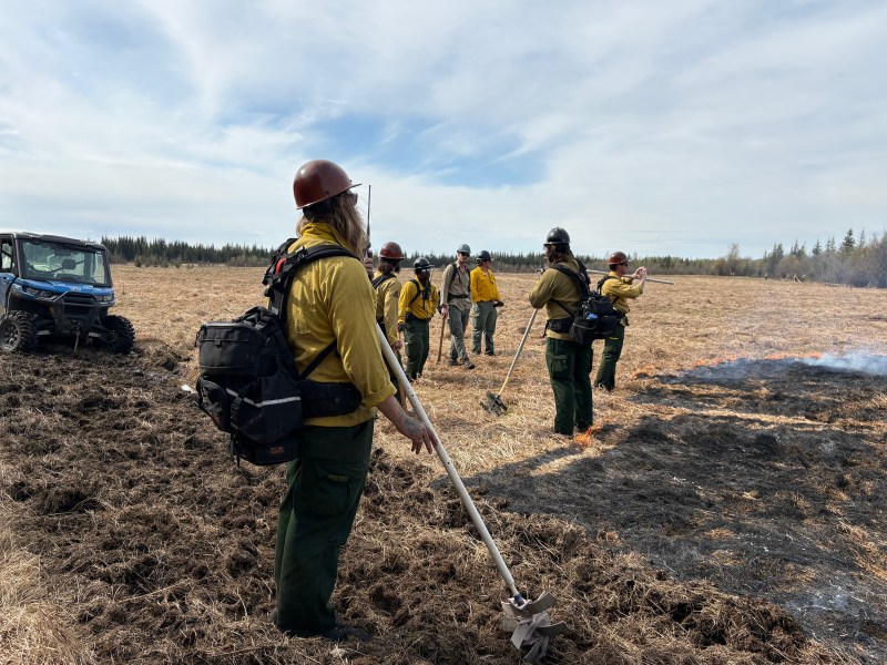Fire Managers assess and discuss the test fire on the Echo Acres Creamers Field 2026 RX