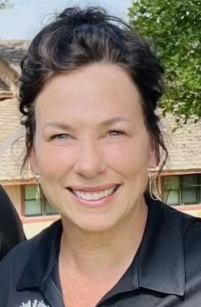 Head and shoulders photo of a smiling woman.