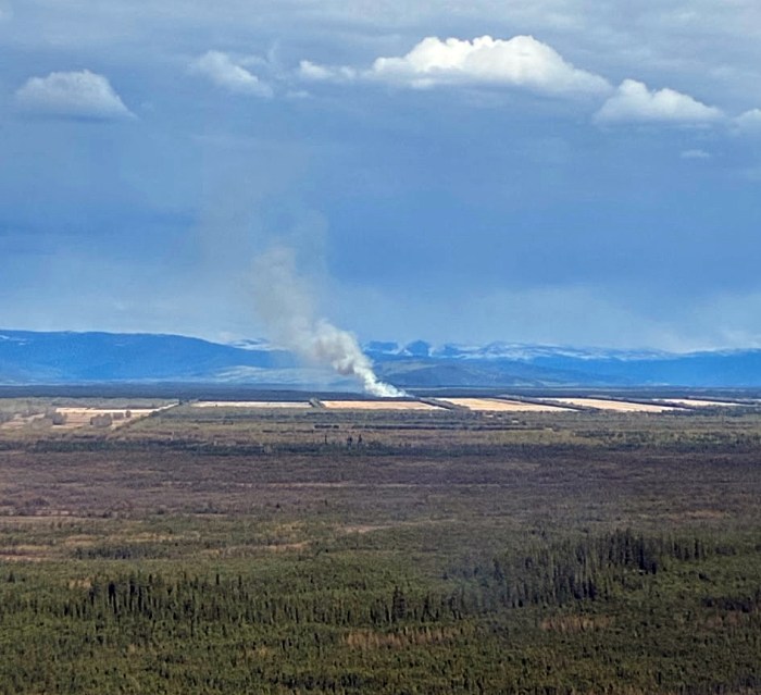 This photo shows smoke rising from a distant wildland fire.