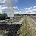 Wildland firefighters burn off dead grasses at a shooting range.