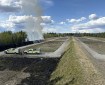 Wildland firefighters burn off dead grasses at a shooting range.