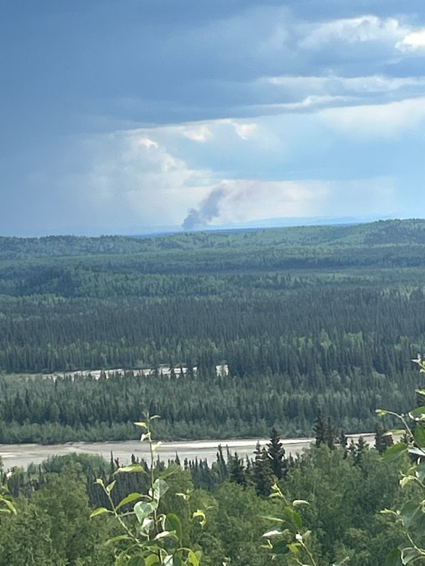 Photo of smoke in the distance of the Granite Fire (#222) with a large swath of black spruce and a river.