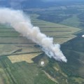Aerial View of the Granite Fire (#222) with a smoke column showing over the agricultural fields in Delta Junction.