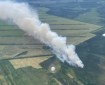 Aerial View of the Granite Fire (#222) with a smoke column showing over the agricultural fields in Delta Junction.