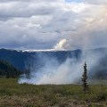 Smoke rises from a wildland fire.