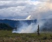 Smoke rises from a wildland fire.