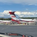 Photo of two retardant tankers on tarmac getting filled with retardant.