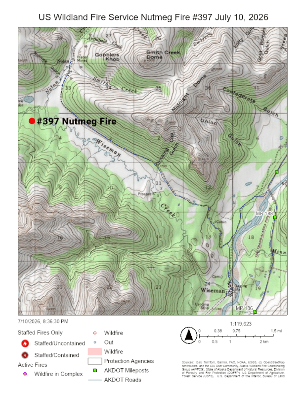 Topographic map showing the location of the Nutmeg Fire as a red dot northwest of a cluster of black dots representing a community.
