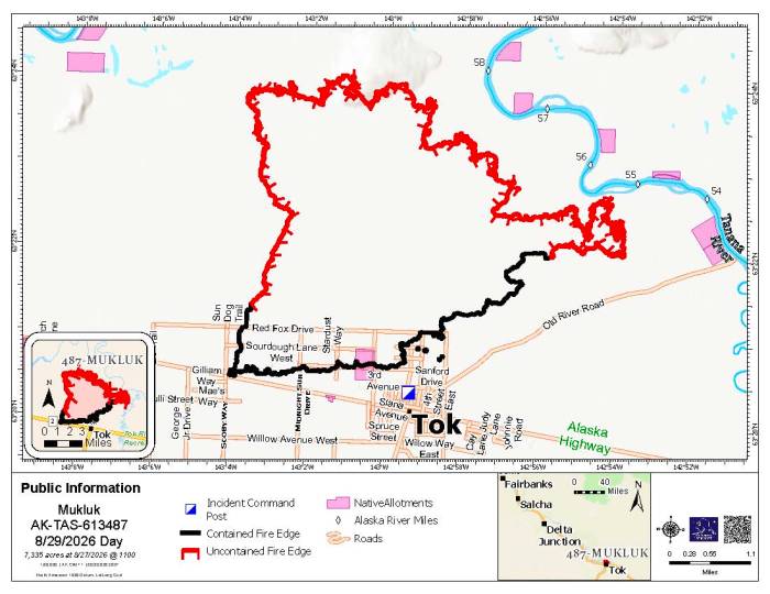 Map of northern roads in Tok and the Mukluk Fire perimeter as black containment line in the community and red fire line for uncontained control line.